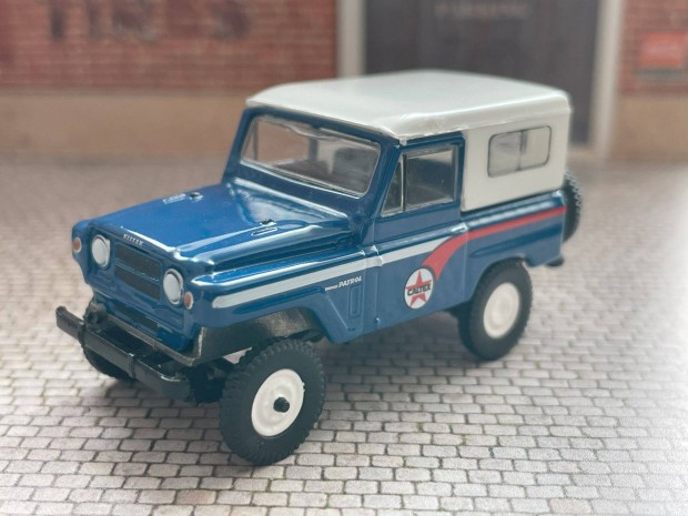 1964 Nissan Patrol modell aut - Greenlight 1:64 mret