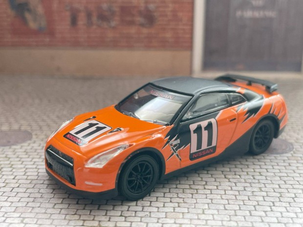 2011 Nissan GT-R (R35) modell aut - Greenlight 1:64 mret