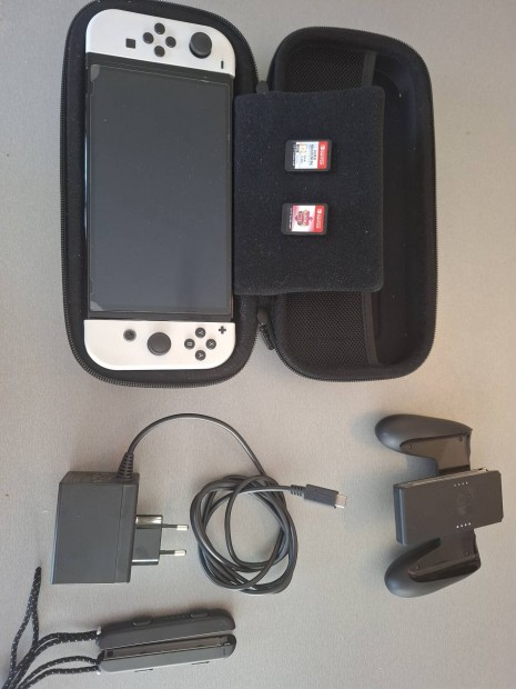 Nintendo Switch OLED + 2 jtk, hordoz