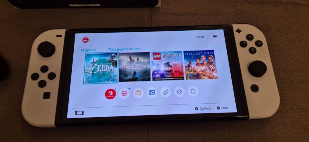 Nintendo Switch OLED fehr + 128GB SD krtya + tok + jtkok