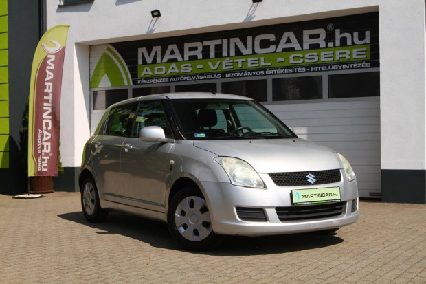 Suzuki Swift 1.3 GLX Silky Silver Metallic +Ere...