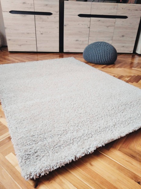 Újszerű 120x170 cm méretű bézs színű szőnyeg