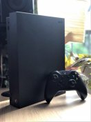 Xbox One X 1 TB dobozában Játékok