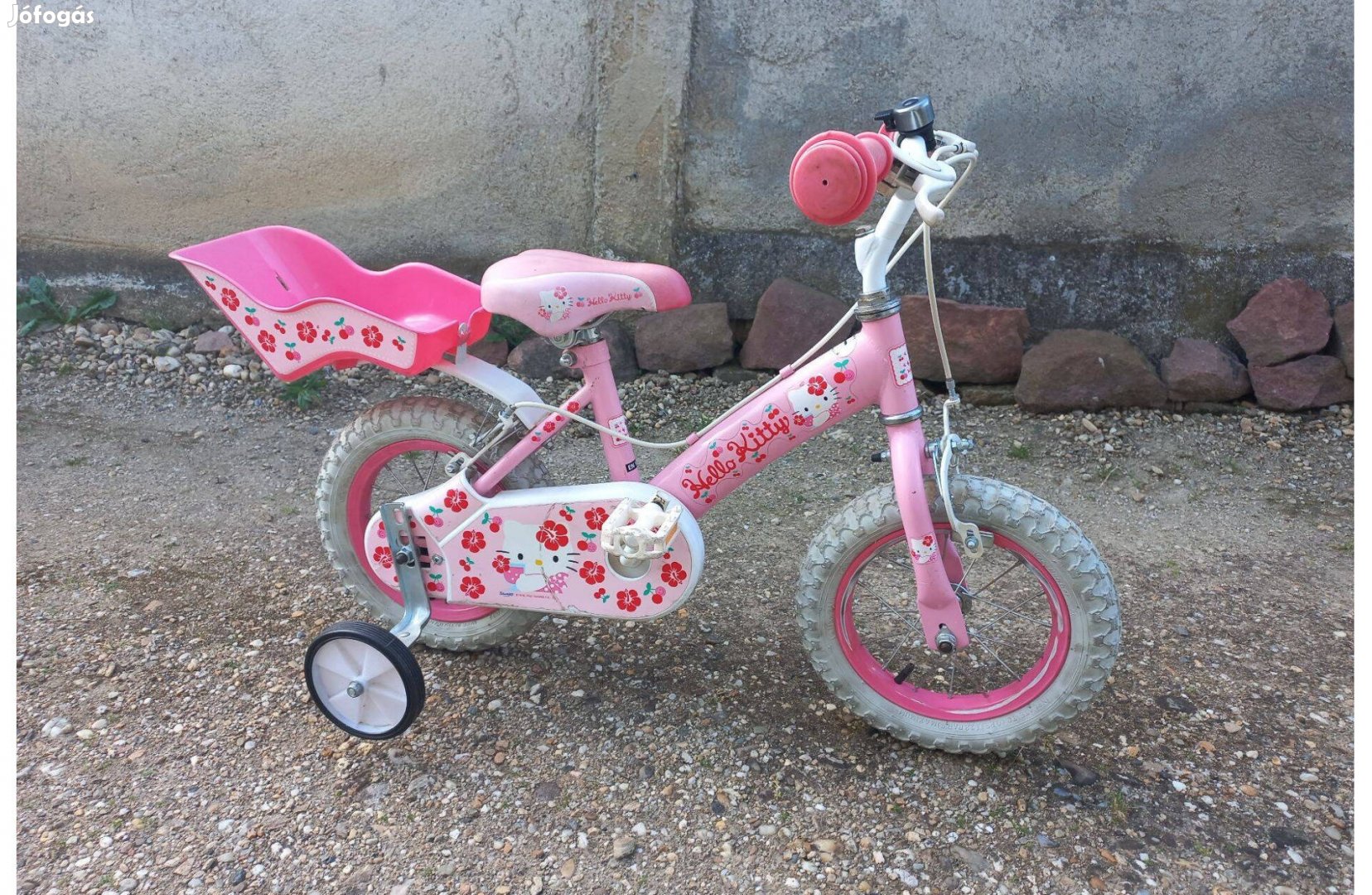 12" Hello Kitty-s pink gyerek bicikli jó állapotban, pótkerékkel eladó