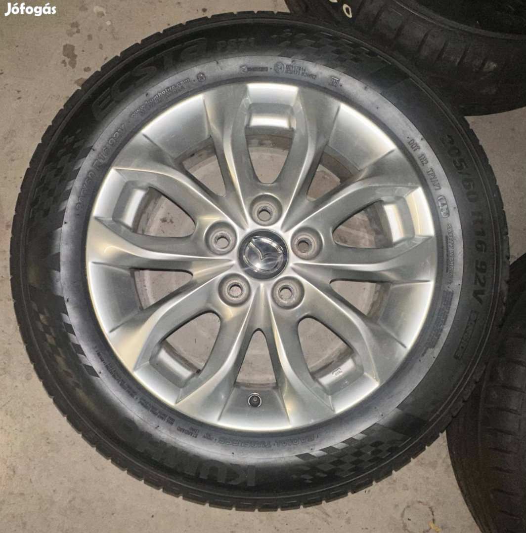 5x114,3 16" 6,5" ET50 67 Mazda használt alufelni komplett kerékben