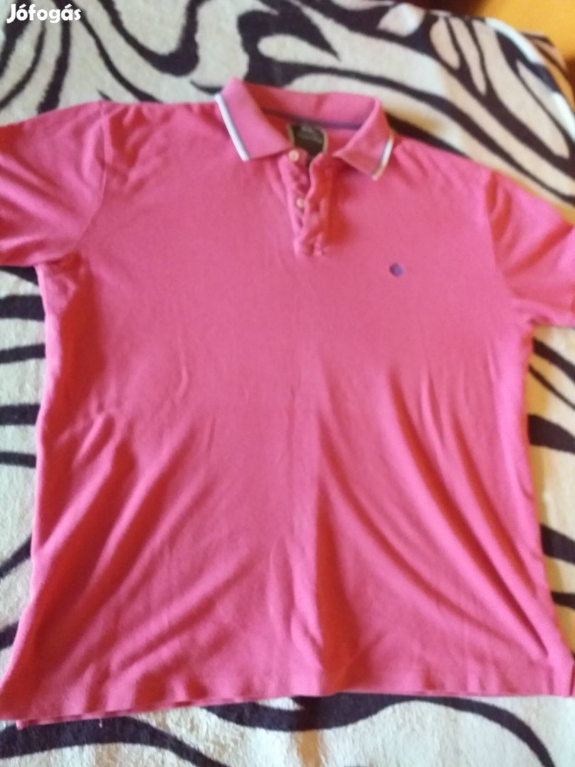 A képen látható pinkszinű póló eladó XL. 42-es