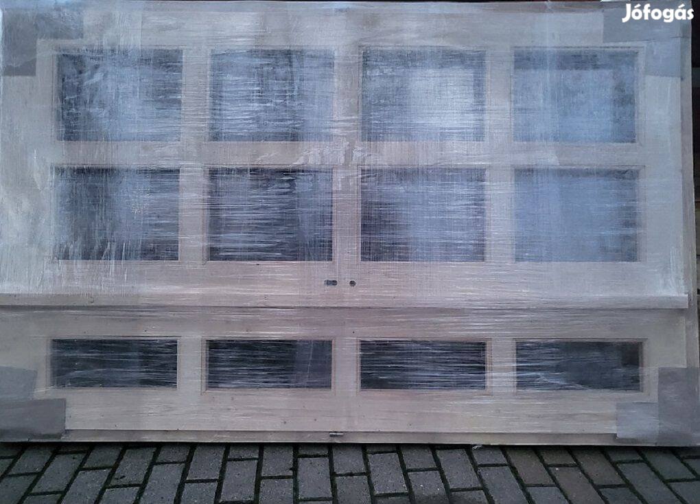 Bejárati ajtó eladó.210x140cm es új