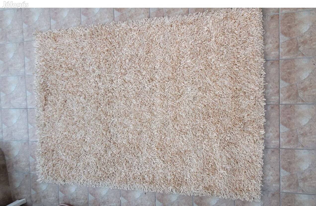 Bézs színű szegett szőnyeg 140x200cm újszerű állapotban eladó