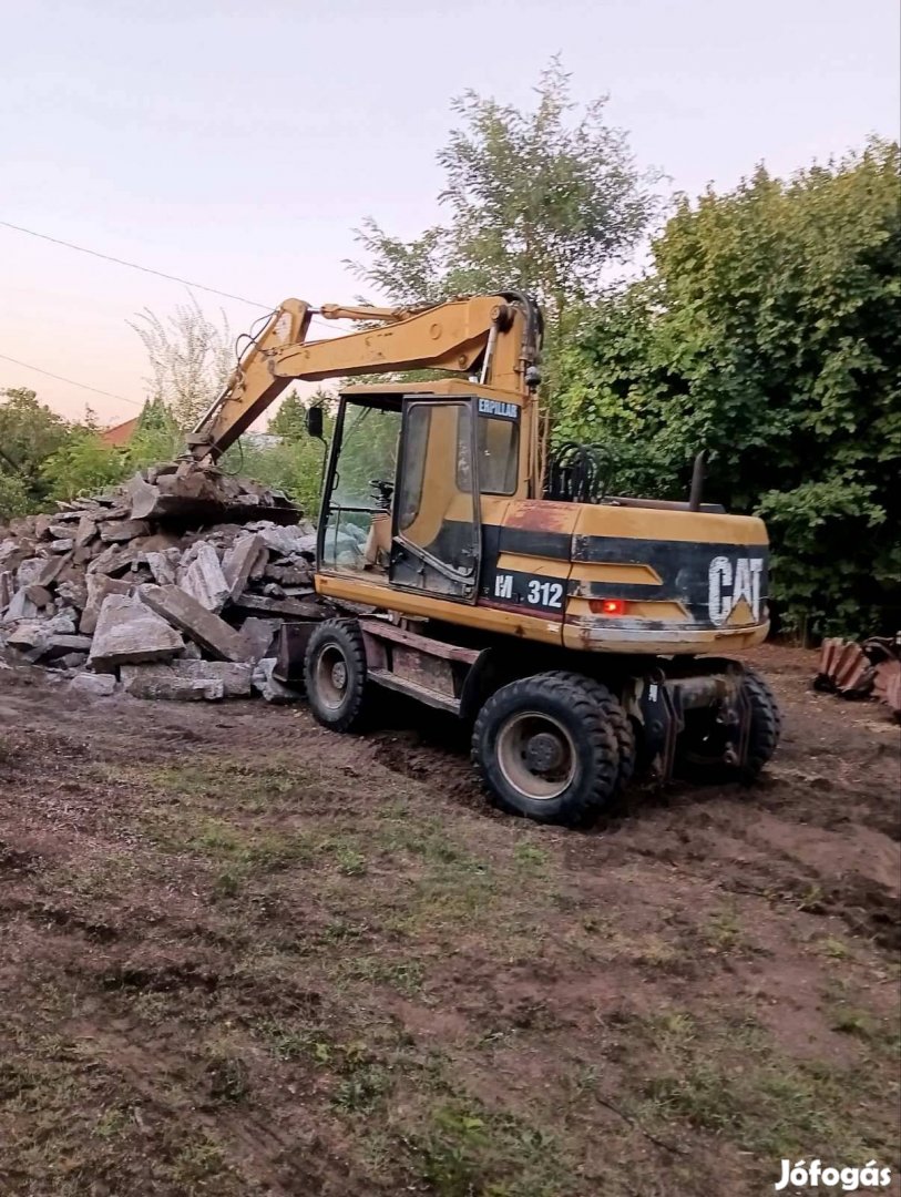 Caterpillar M312 gumikerekes kotró