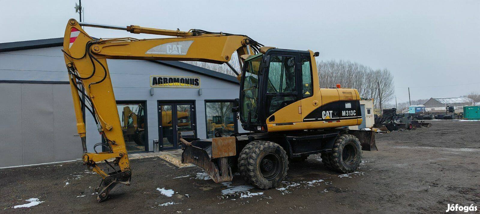 Caterpillar M313C gumikerekes forgókotró