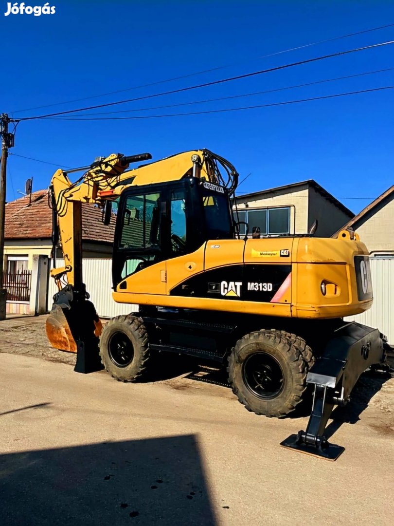 Eladó Caterpillar M313D Gumikerekes Kotrógép
