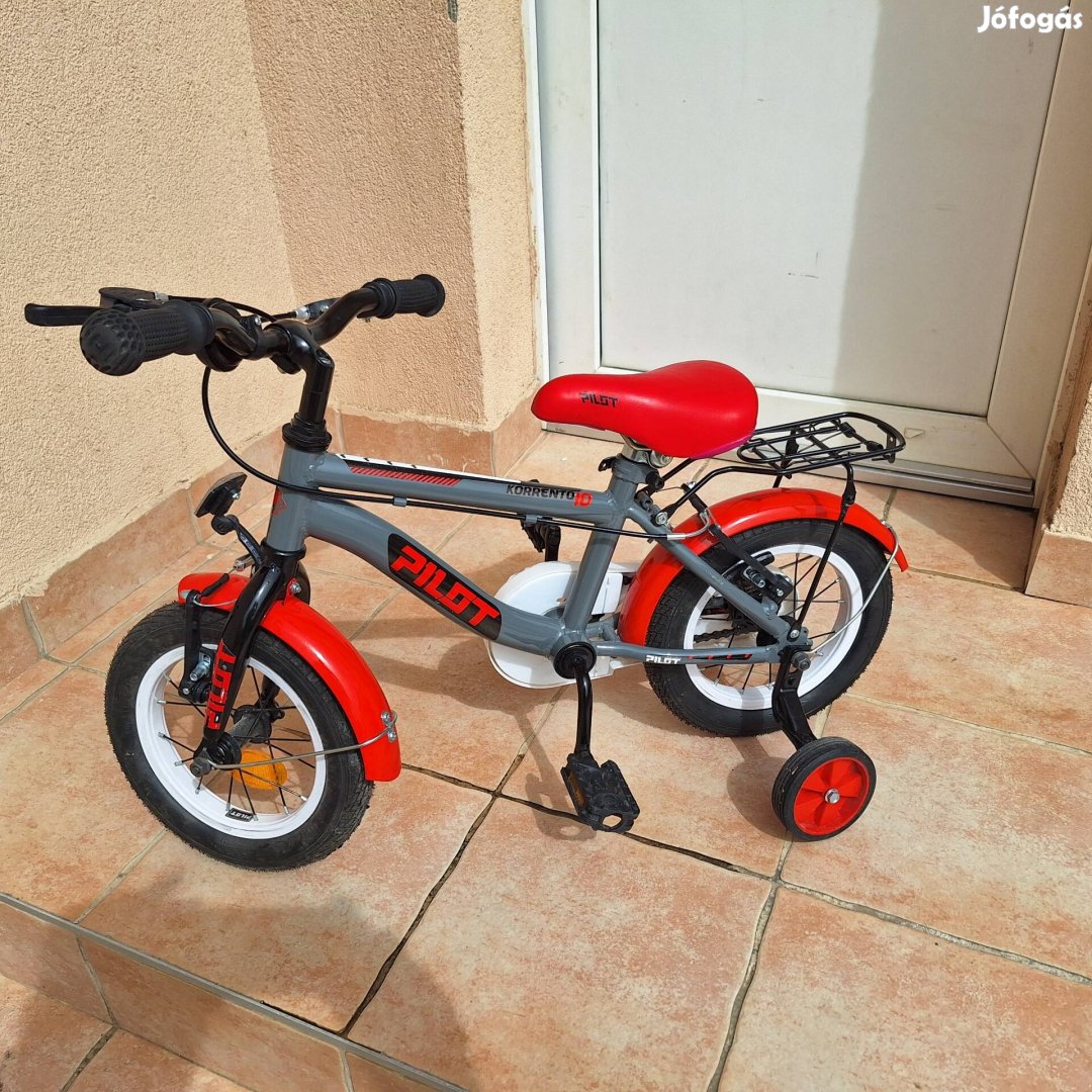Eladó  új 12"Gyermek bicikli piros  csomagtartóval 