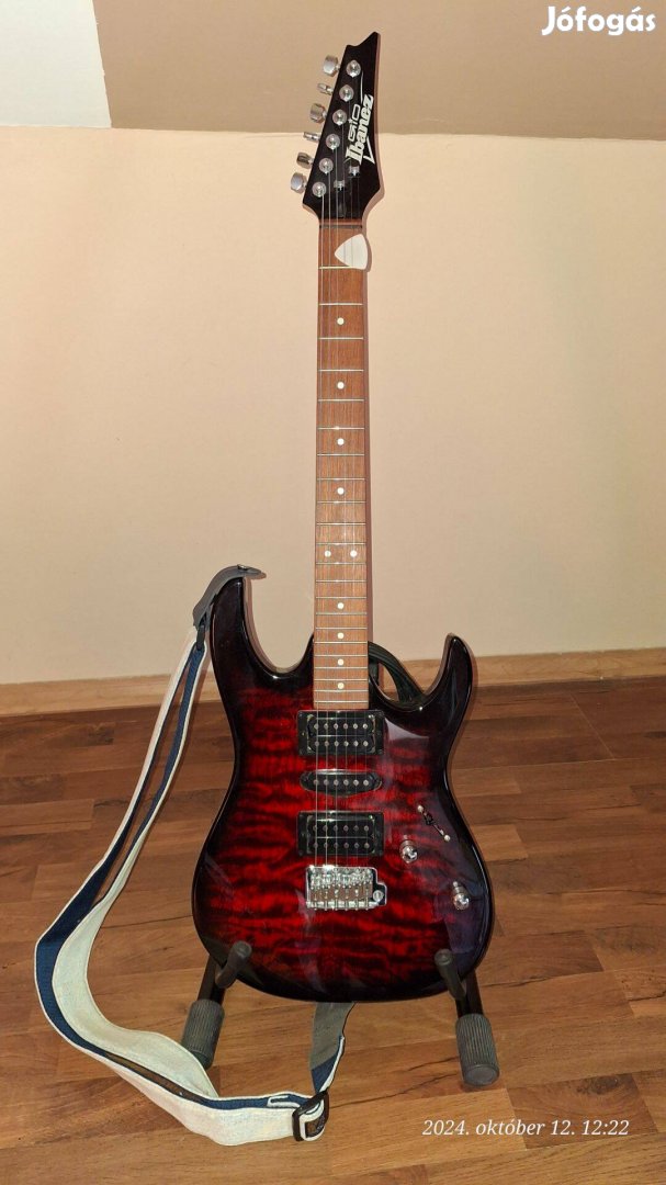 Eladó kiváló állapotú Ibanez Grx70QA-TRB gitár, hevederrel, állvánnyal