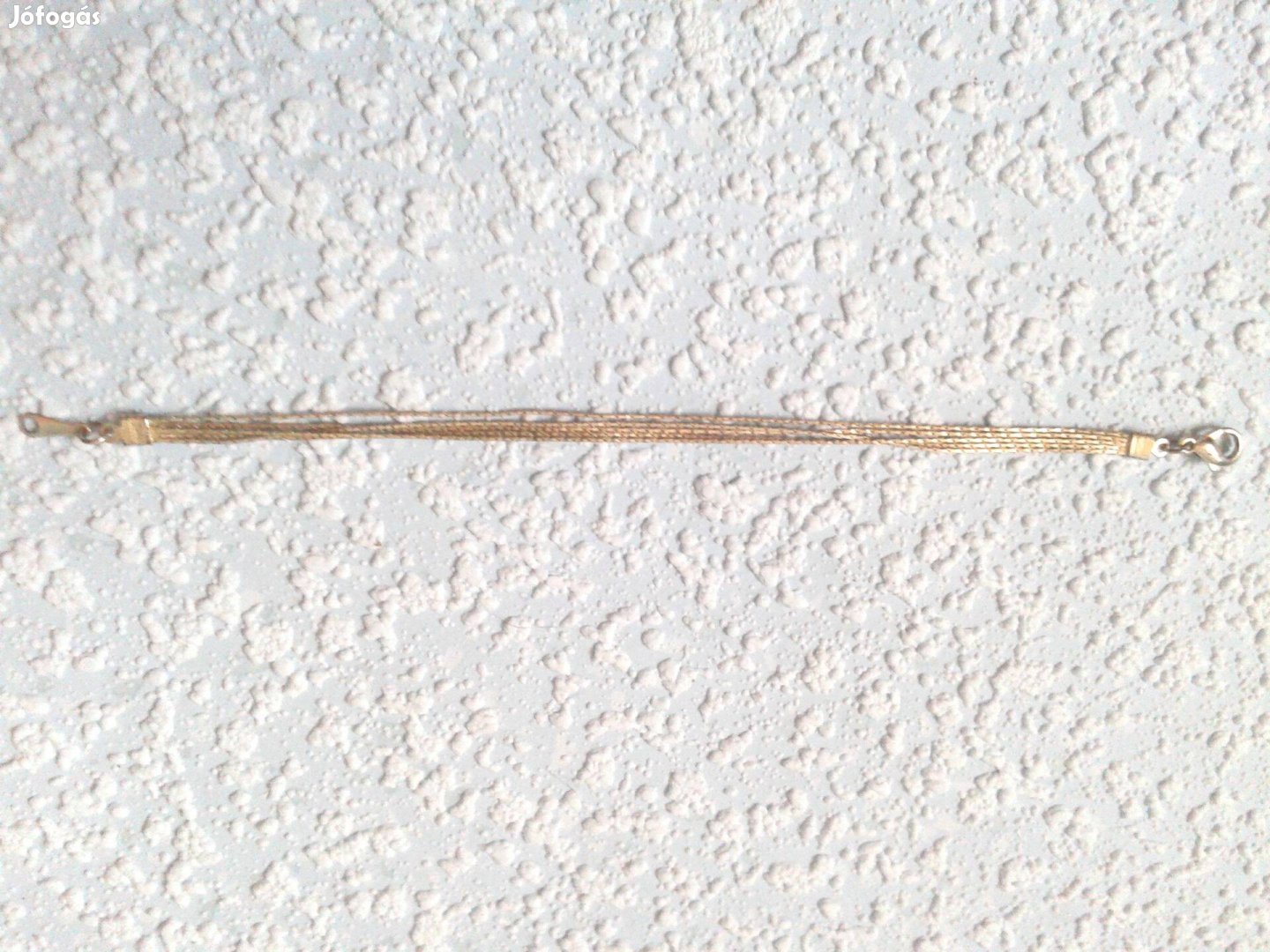 Ezüst színű 4 soros női karkötő karlánc lapos mintás 1 200 Ft