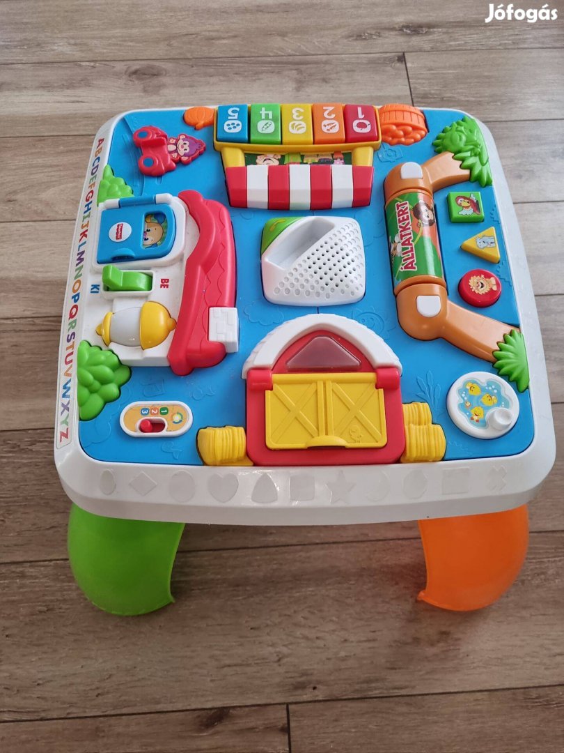 Fisher price zenélő asztal