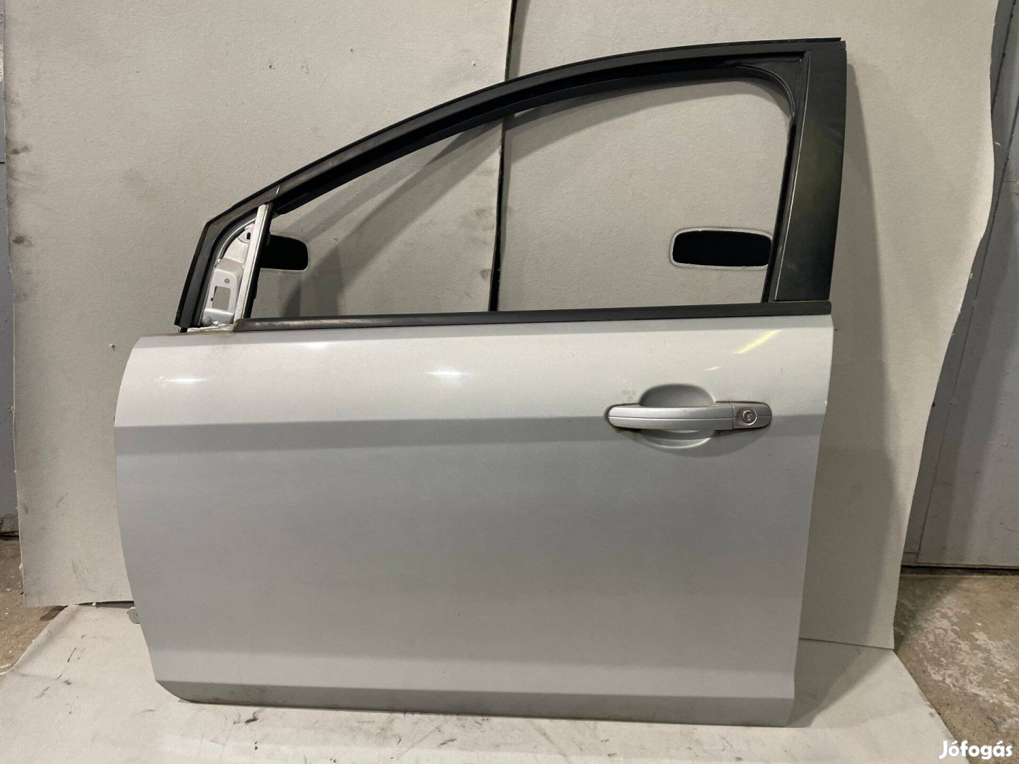 Ford Focus Mk2.5 ezüst 03 színkódú bal első rozsda mentes ajtó