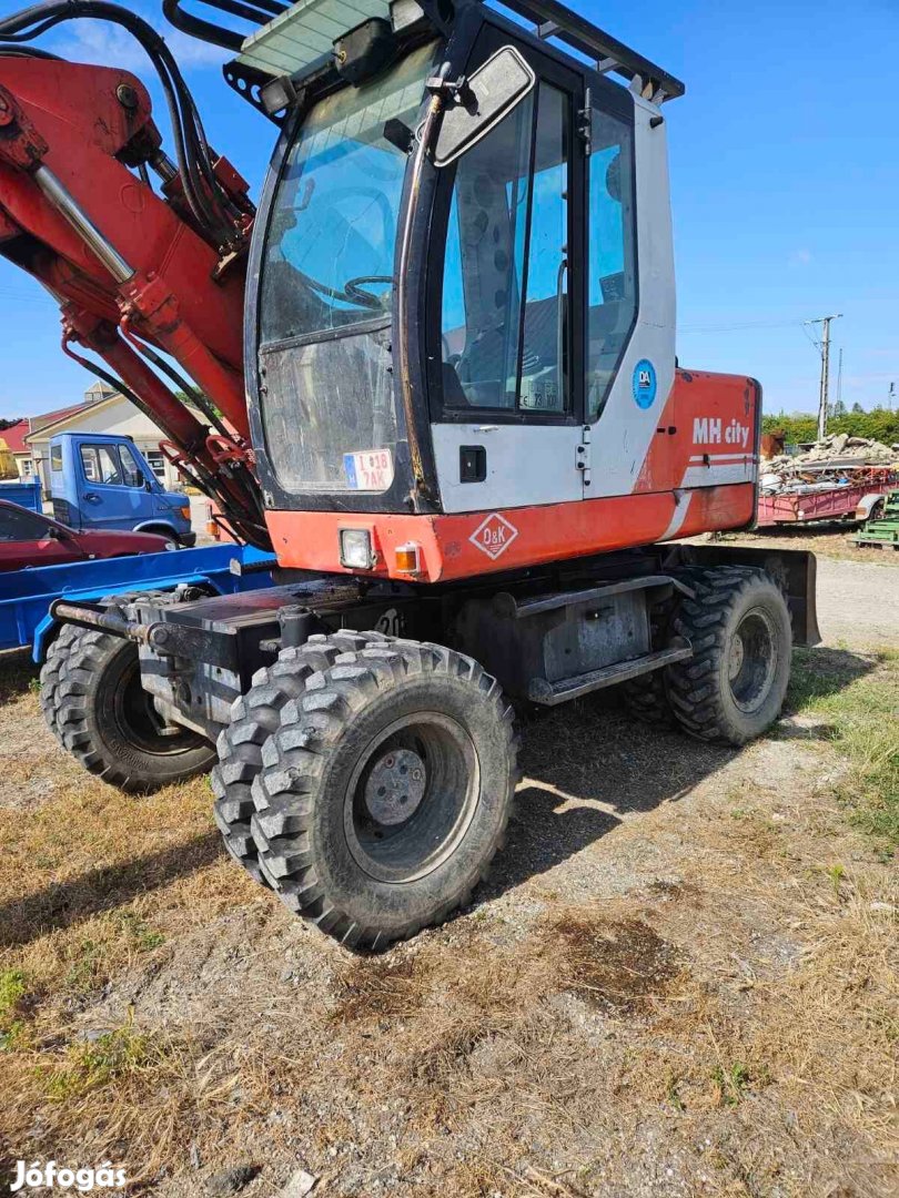 Gumikerekes forgókotró, gémes rakodó, munkagép, földmunkagép