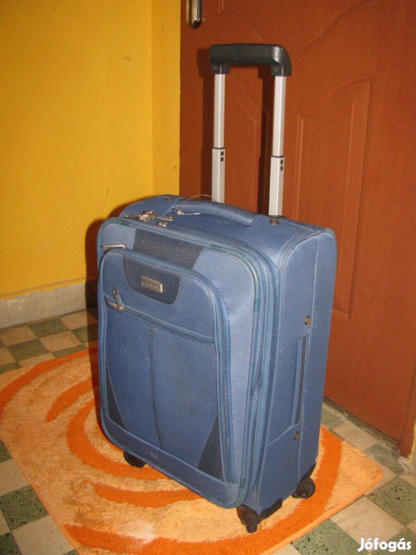 Guruló bőrönd, 55x35x23-25, repülőre is, Wordline 4 görgő, 3kg