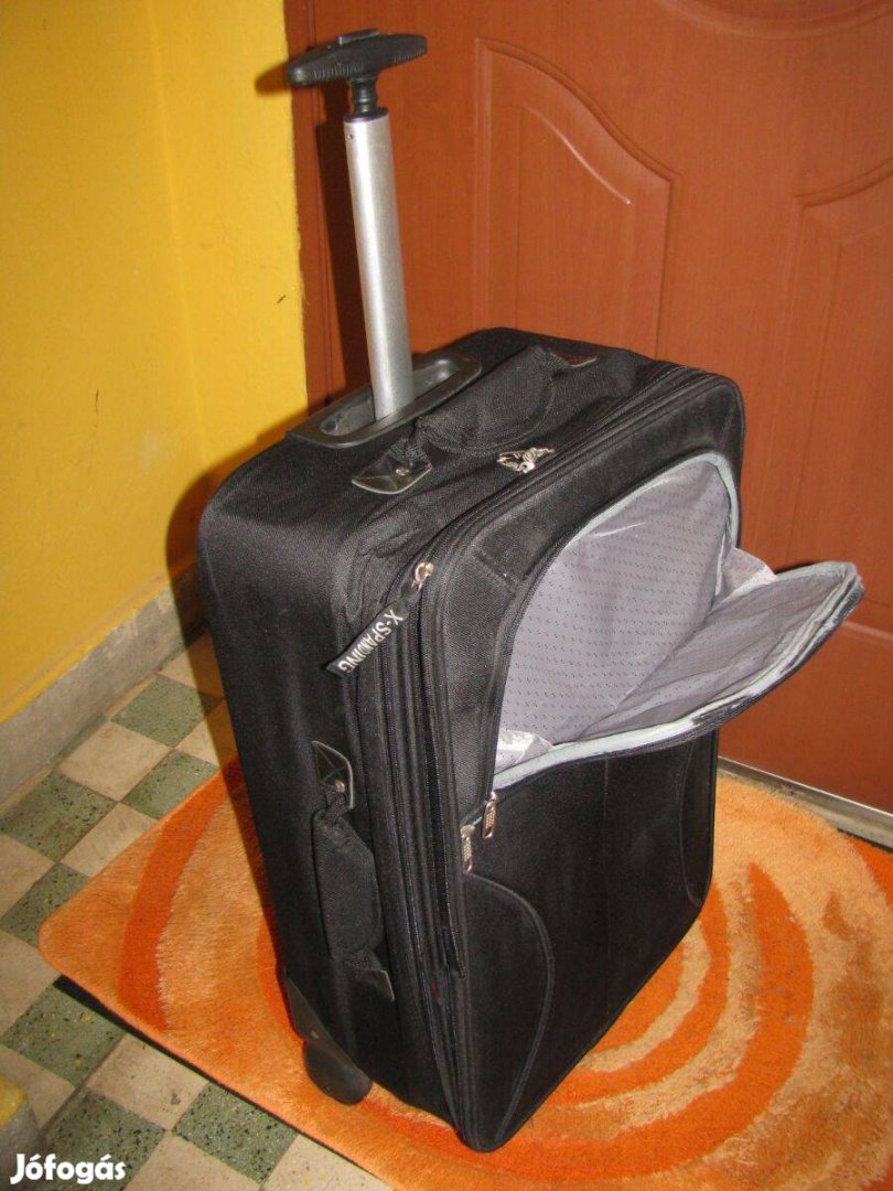 Gurulós bőrönd Travelburg, 60x37x20-24, újszerű, 1erős karú, 2 görgő,