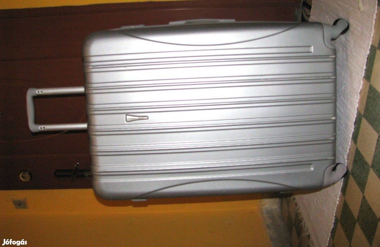 Gurulós bőrönd ezüst 78x50x33, Abs 4 görgő erős keményfal, kiváló