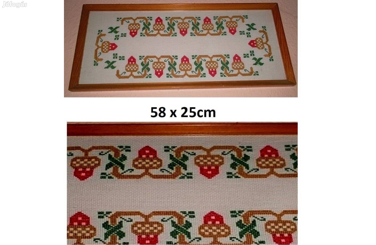 Hímzett falikép keretben