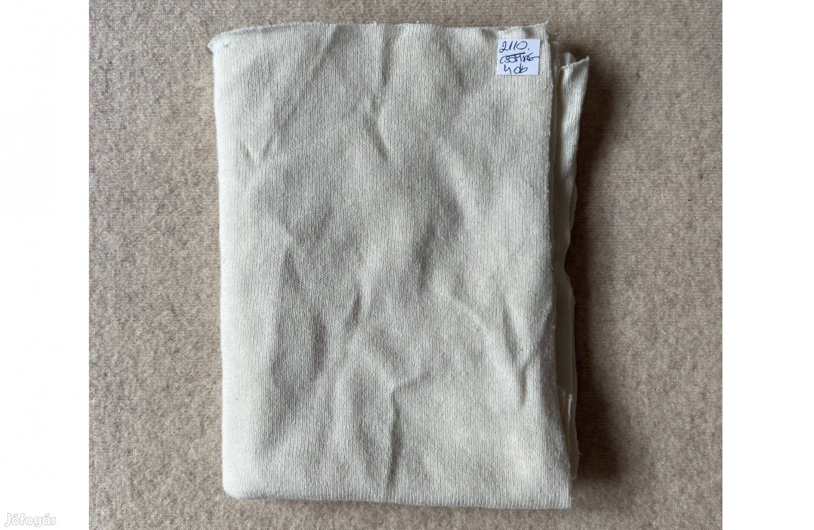 Méteráru, textil kötött jellegű pamut krémszín csomag