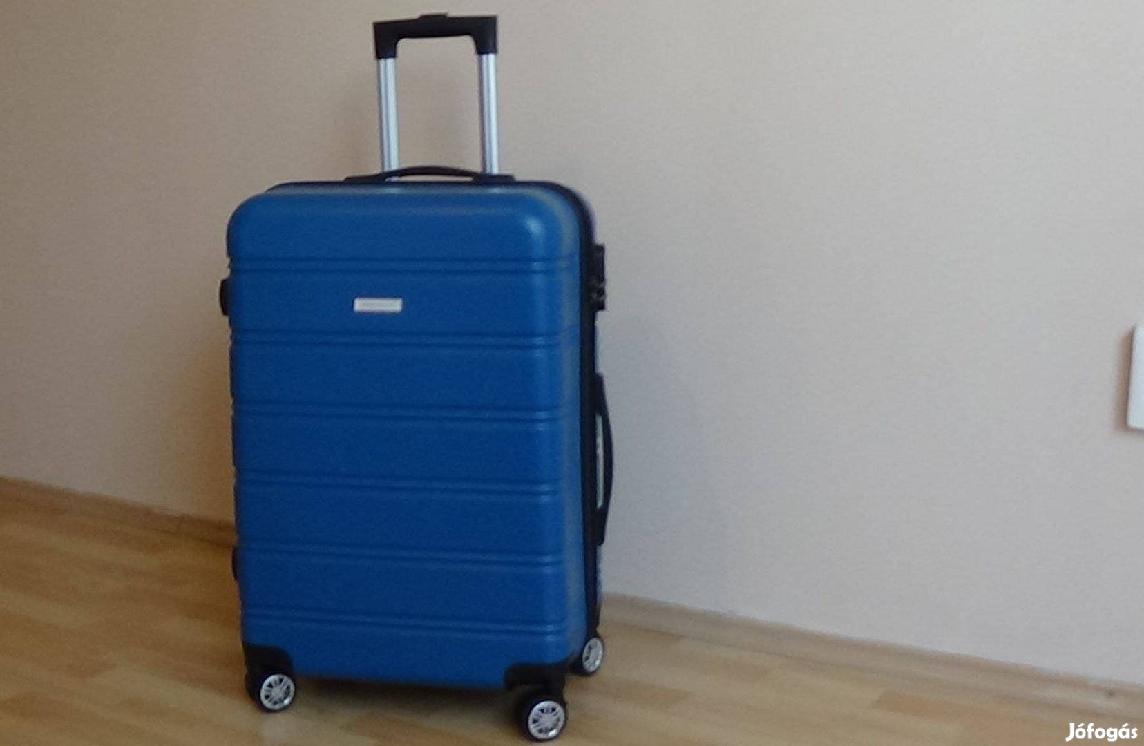 Négykerekes bőrönd , új ( 64 x 43 x 26 cm )