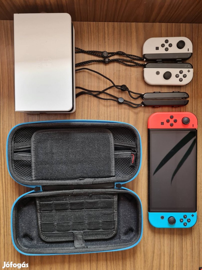 Nintendo Switch OLED + Kék, Piros Joy-Con pár + tároló tok
