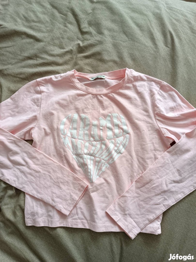 Női , rövid derekú felső.