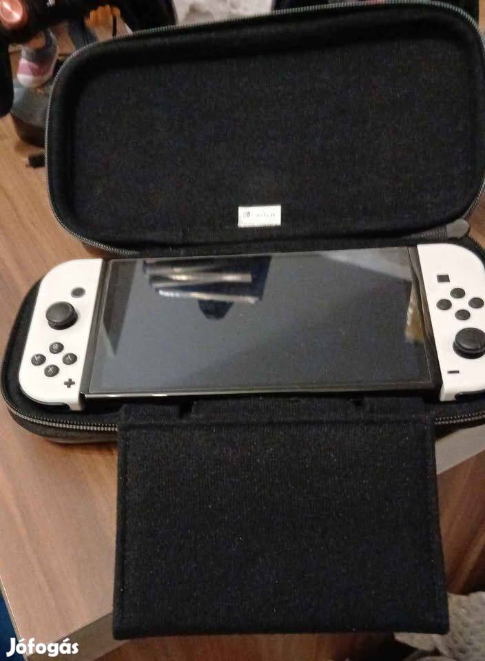 Nyugatiná Nintendo Switch Oled + 30 játék+garancia +tok + kontroller +