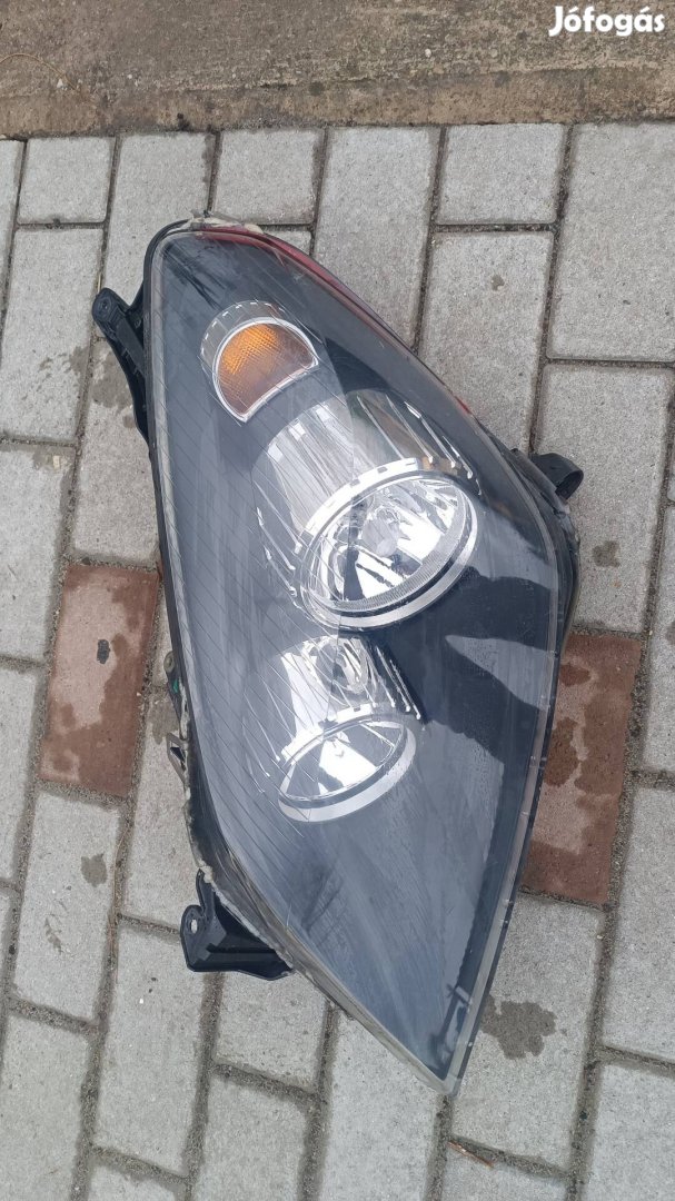 Opel Astra H fekete hátteres bal első gyári bontott fényszóró lámpa