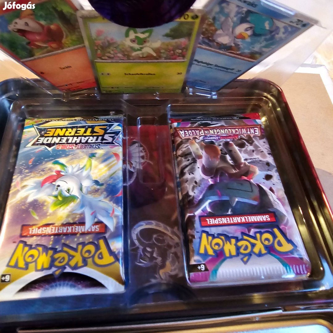 Pokemon játék fém böröndben teljesen új Német nyelvü a tartalma látsz