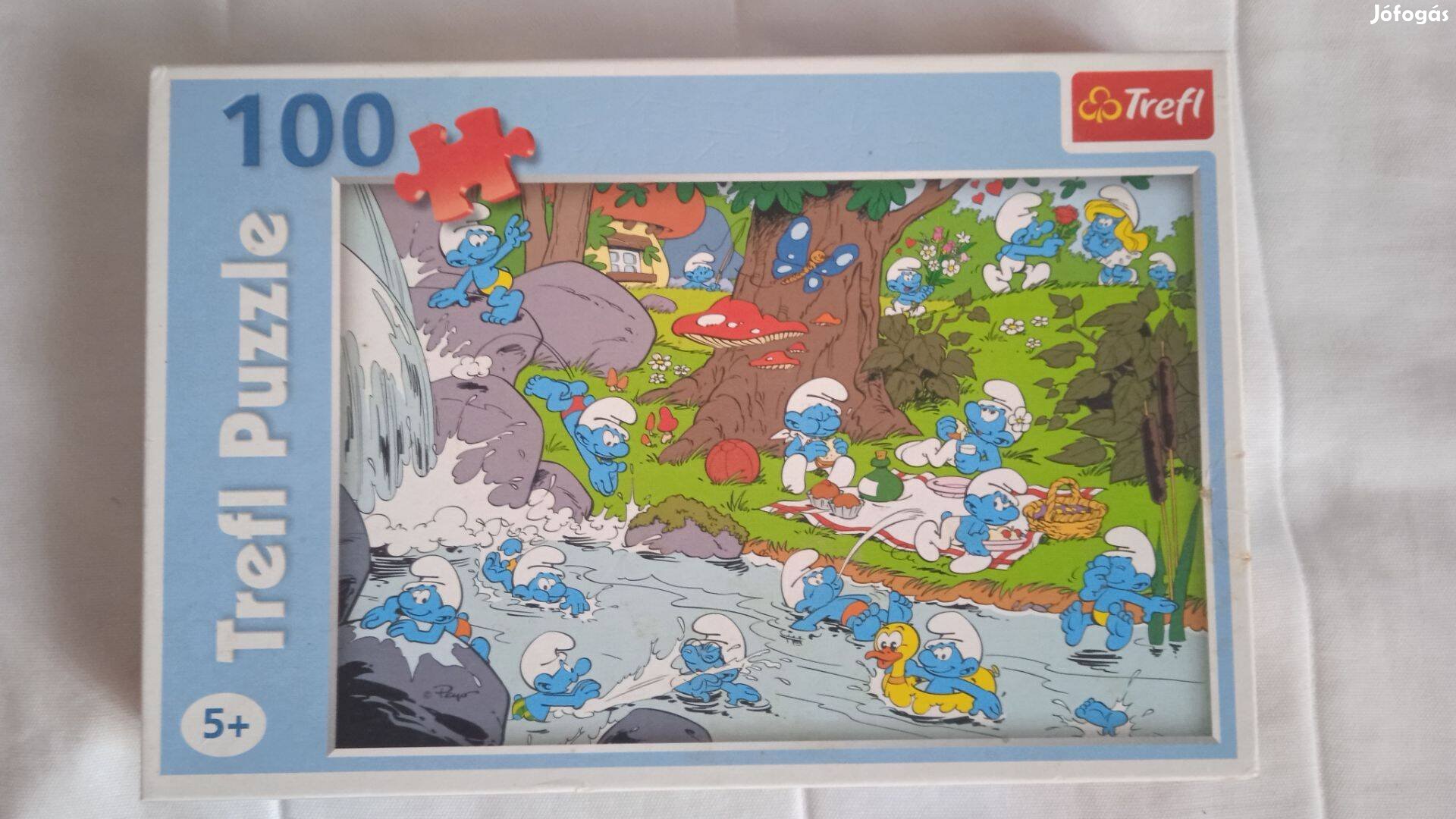 Puzzle 100 db-os Hupikék törpikék - A folyóparton
