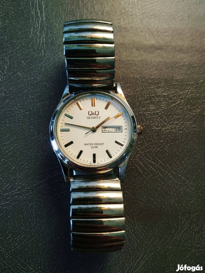 QQ női karóra - ezüst színű gumis szíjjal - javításra,