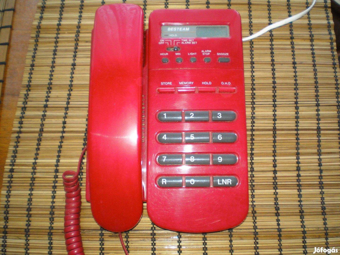Régebbi piros színű telefon szép állapotban ébresztős