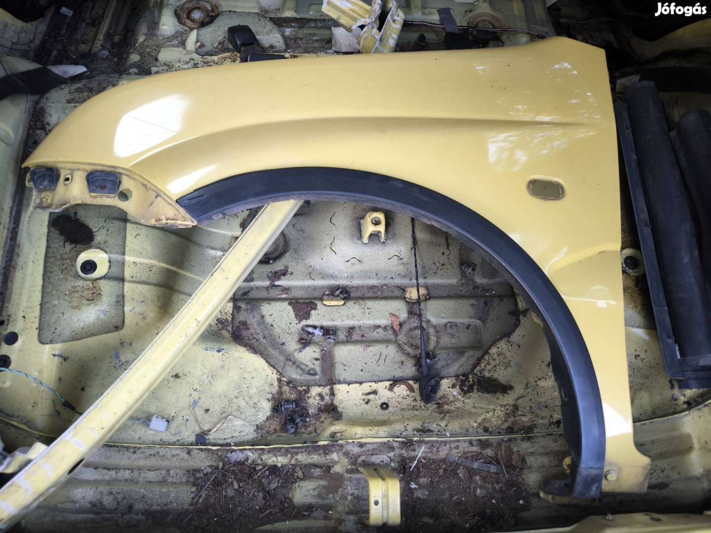 Suzuki Ignis 2003 tól bal első sárvédő 