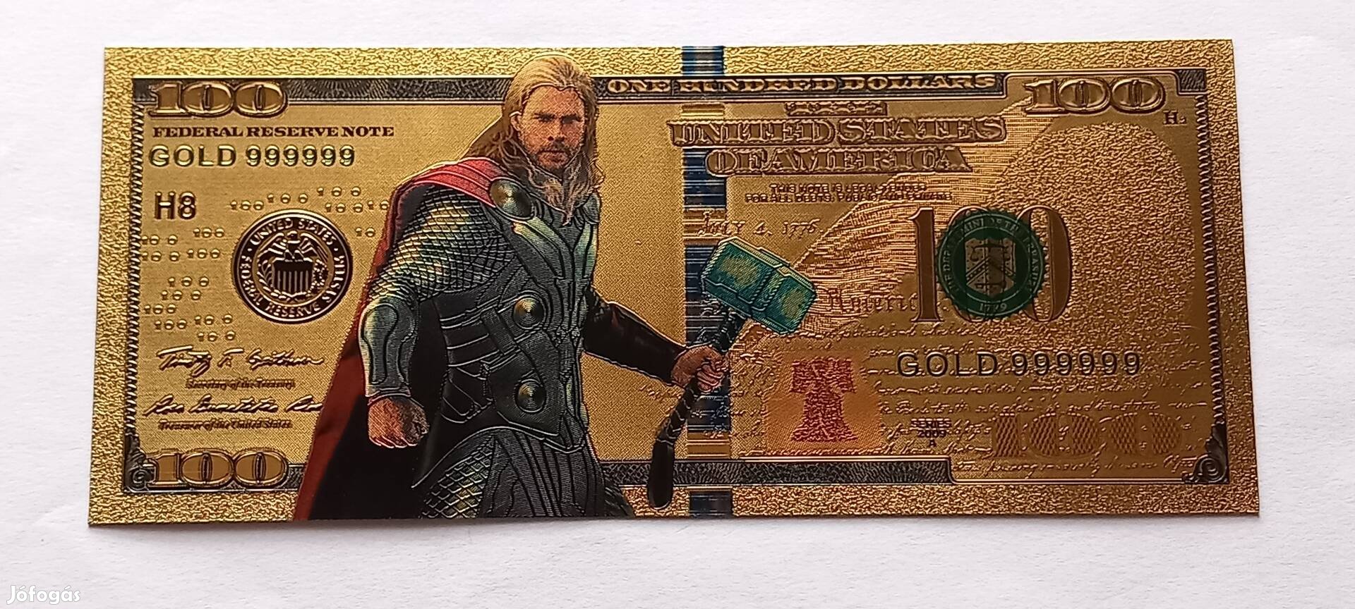 Thor - színes, aranyozott, plasztik fantázia 100 dollár