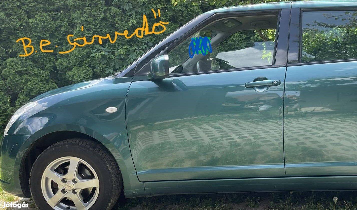 Zöld Suzuki Swift III bal első sárvédő