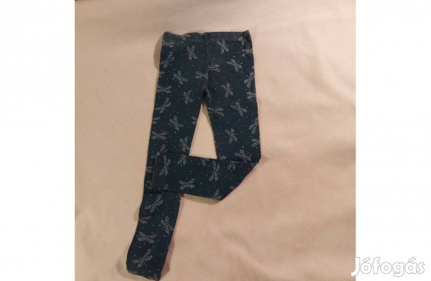 122-es méretű, sötétzöld alapon fehér mintás kislány leggings