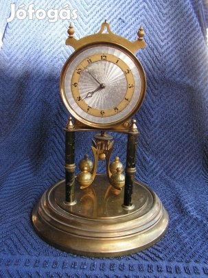 400 napos, mechanikus, forgó ingás, üvegbúrás kandalló óra