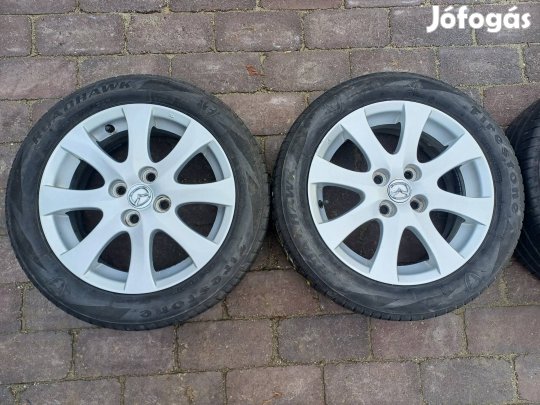 4x100 R15 Mazda alufelni 185/55R15 nyári gumikkal 