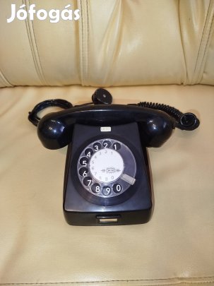 57 éves , régi , retro , vintage , vezetékes , tárcsás fekete telefon 