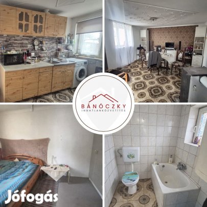 Baján a Belvároshoz közel házrészt autóbeállóval!