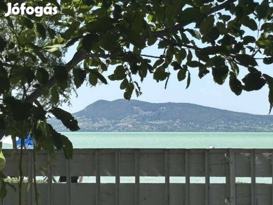 Balatonon, vízparti telek házzal eladó