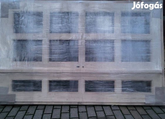Bejárati ajtó eladó.210x140cm es új