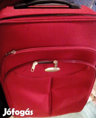Bordó, húzókaros, gurulós, többrekeszes, számzáras bőrönd eladó!