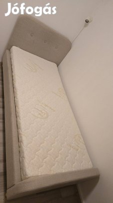 Eladó 90*200-as fekvő felületű szövet kárpitozott ágy