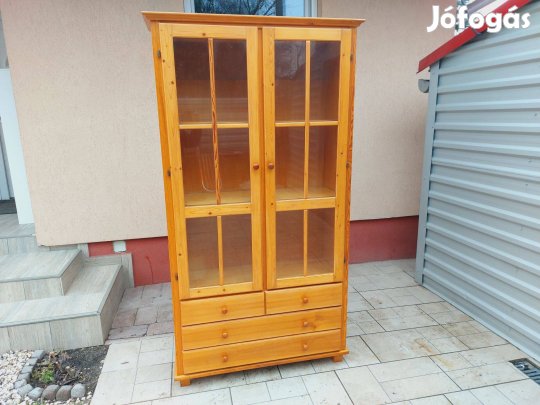 Eladó egy Magas , 4 fiókos , polcos vitrines szekrény. Bútor jó állap