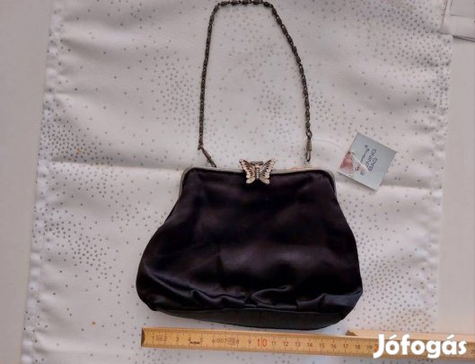 Eladó egy pillangós, új , címkés fekete ruhatáska. Superdrug márka