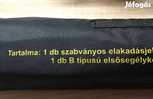 Elakadásjelző, sárga mellénnyel